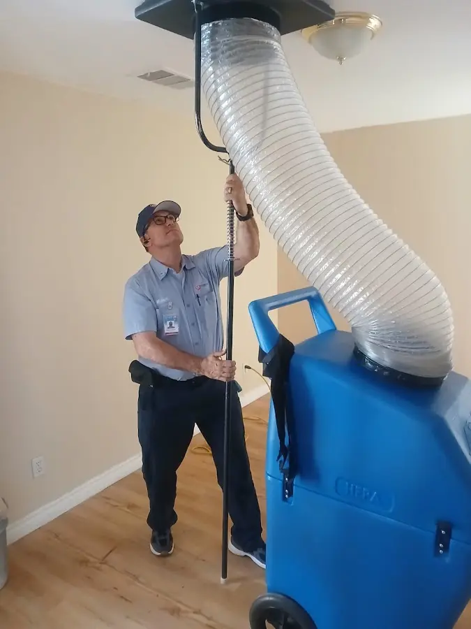 HVAC Installation technician using HEPA equipment in Hugo